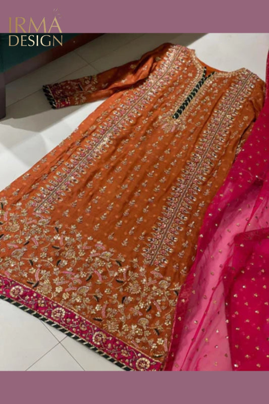 Pakistani formal shalwar kameez in burnt orange and hot pink